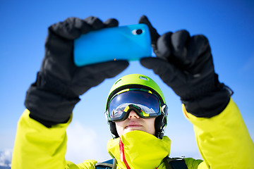Image showing Man in winter clothes taking a selfie