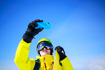 Image showing Man in winter clothes taking a selfie