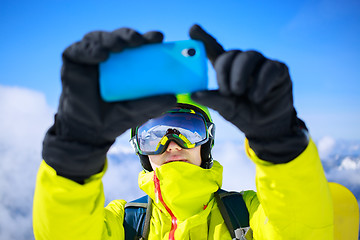 Image showing Man in winter clothes taking a selfie