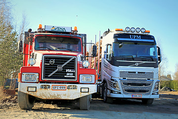 Image showing Volvo N12 and Volvo FH16 Past and Present Trucks Side By Side 