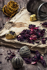 Image showing old book is strewn with the tea leaves