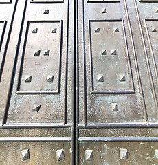 Image showing  in mercallo rusty brass brown knocker door curch  closed metal 