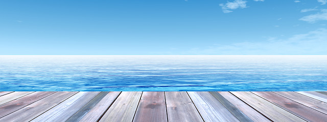 Image showing Conceptual wood deck over sea and sky banner