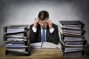 Image showing Overworked businessman