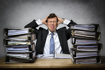 Image showing Overworked stressed businessman