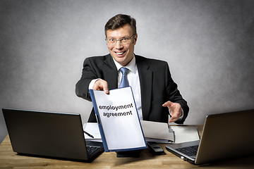 Image showing Boss gives employment agreement