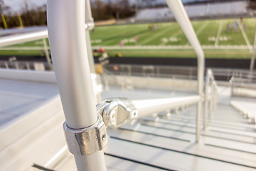 Image showing handrail connector at a sports stadium steps