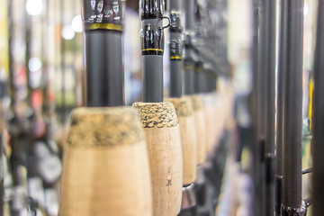 Image showing photo of row of fishing rods in store