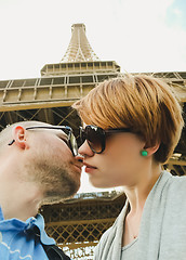 Image showing Young couple near the Eiffel Tower in Paris