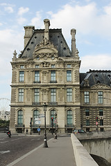 Image showing France, Paris - June 17, 2011: People walking in front of famous Louvre museum 