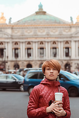 Image showing blonde woman portrait in front of Opera theater Paris, France.