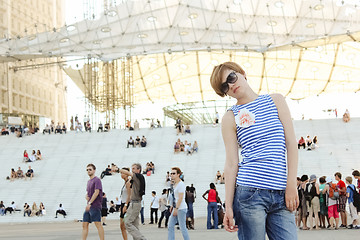 Image showing Young woman in Paris, looking at the La Grande Arche de la Defense