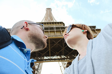Image showing Young couple near the Eiffel Tower in Paris