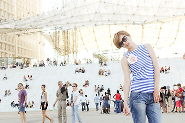 Image showing Young woman in Paris, looking at the La Grande Arche de la Defense