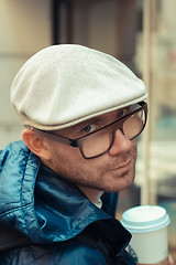 Image showing Bald man drinking coffee