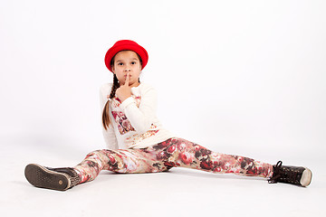 Image showing Little girl sitting on the floor