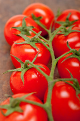 Image showing fresh cherry tomatoes on a cluster