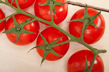 Image showing fresh cherry tomatoes on a cluster