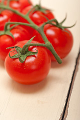 Image showing fresh cherry tomatoes on a cluster