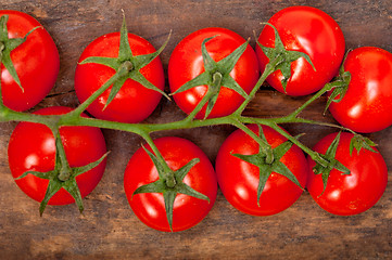 Image showing fresh cherry tomatoes on a cluster