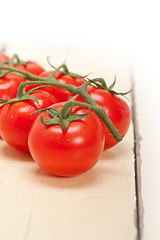 Image showing fresh cherry tomatoes on a cluster