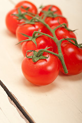 Image showing fresh cherry tomatoes on a cluster