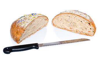 Image showing Two half loafs of bread with knife