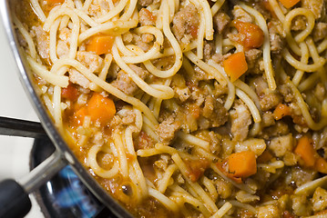 Image showing spaghetti bolognese cooking on stove