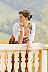 Image showing Bavarian girl on a balcony