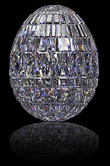 Image showing Easter egg composed of gemstones on glossy black background