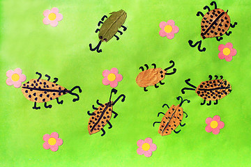 Image showing Children's odd with beetles with pink flowers