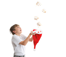 Image showing Boy catching falling presents