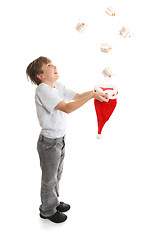 Image showing Boy catching presents