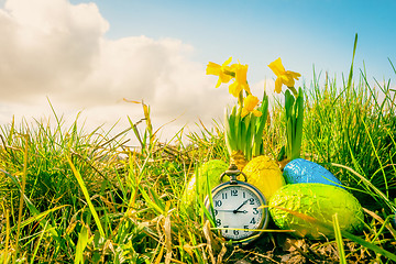 Image showing Easter eggs and a clock