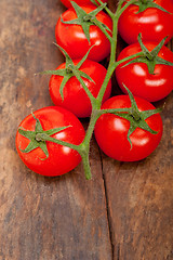 Image showing fresh cherry tomatoes on a cluster