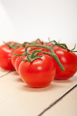 Image showing fresh cherry tomatoes on a cluster