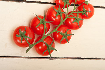 Image showing fresh cherry tomatoes on a cluster