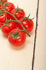 Image showing fresh cherry tomatoes on a cluster