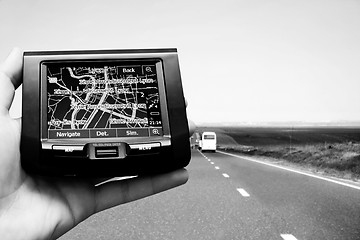 Image showing GPS Vehicle navigation system in a man hand.