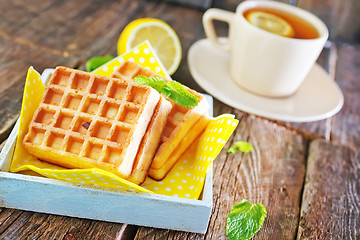 Image showing tea with lemon and waffle