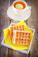 Image showing tea with lemon and waffle