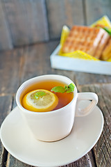 Image showing tea with lemon and waffle