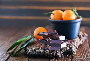 Image showing chocolate and tangerines