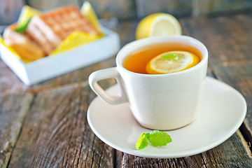 Image showing tea with lemon and waffle