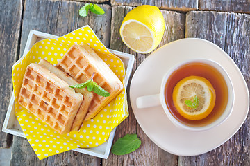 Image showing tea with lemon and waffle