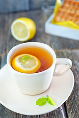 Image showing tea with lemon and waffle