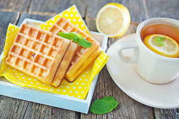 Image showing tea with lemon and waffle