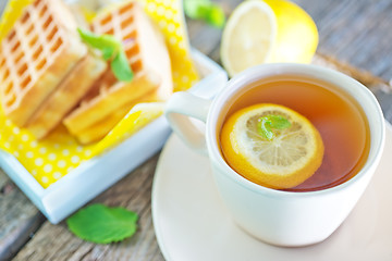 Image showing tea with lemon and waffle