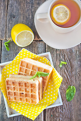 Image showing tea with lemon and waffle