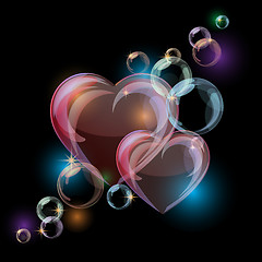 Image showing Romantic background with colorful bubble hearts shapes on black background. 